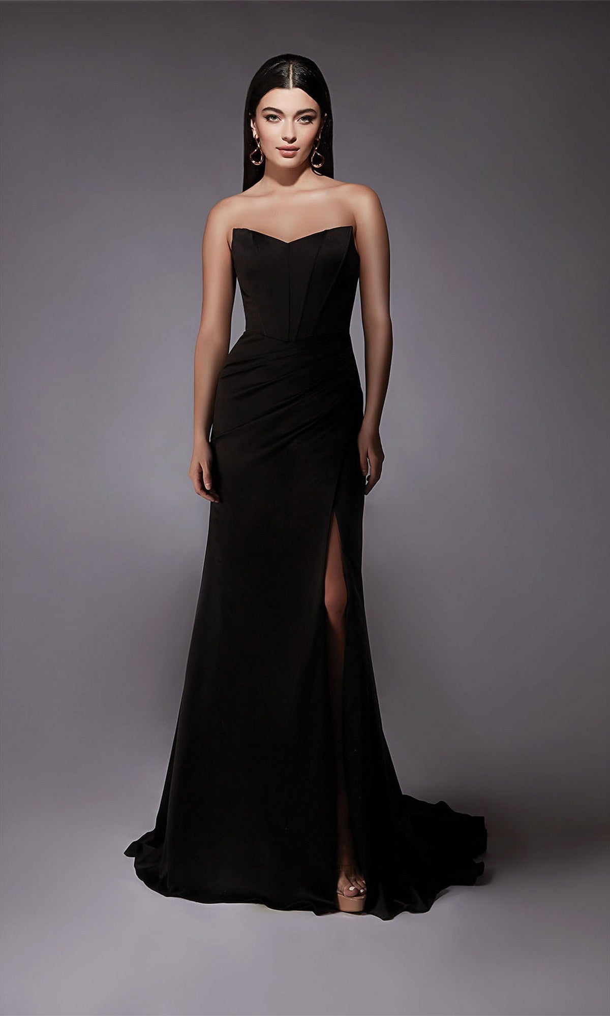 A woman models the Alyce 7093 long formal dress, a strapless satin gown with a thigh-high slit, standing against a plain gray background.